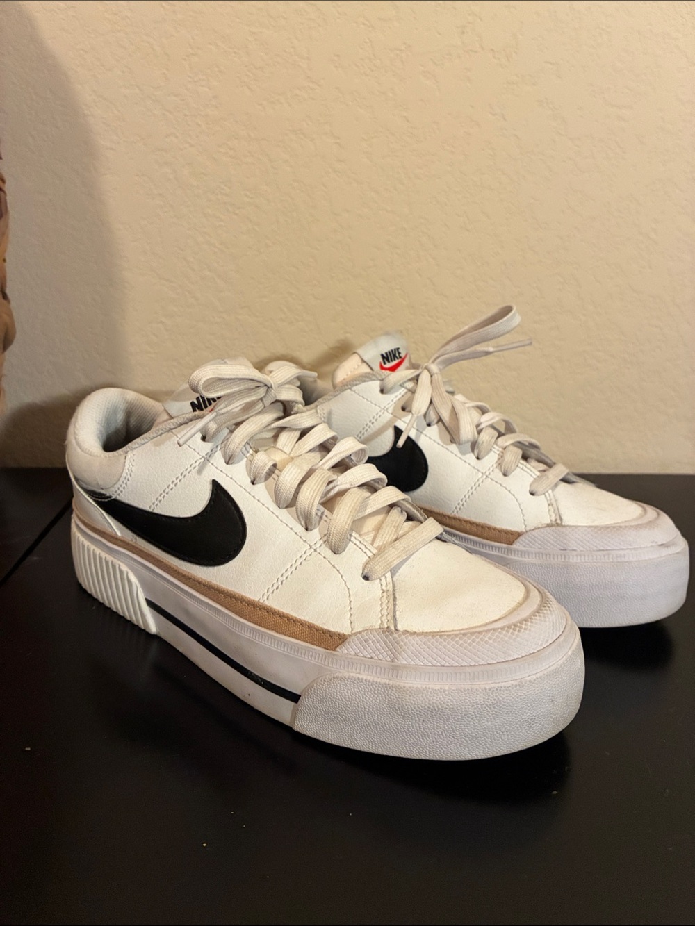Nike Women’s White Sneakers with Black Swoosh and Tan Accent